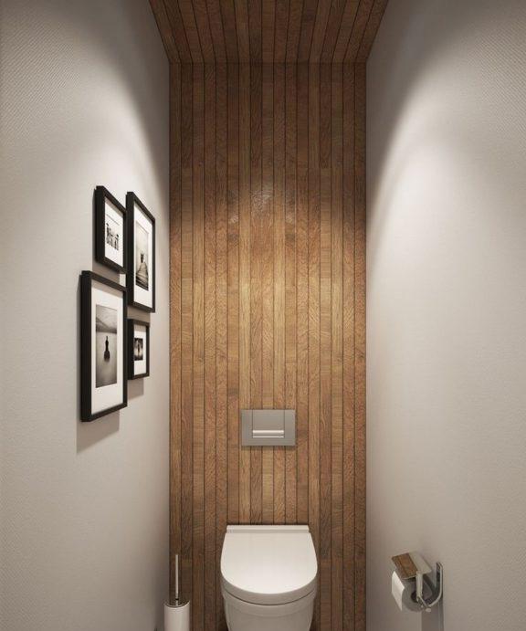Mattonelle di legno e vernice grigia nella toilette