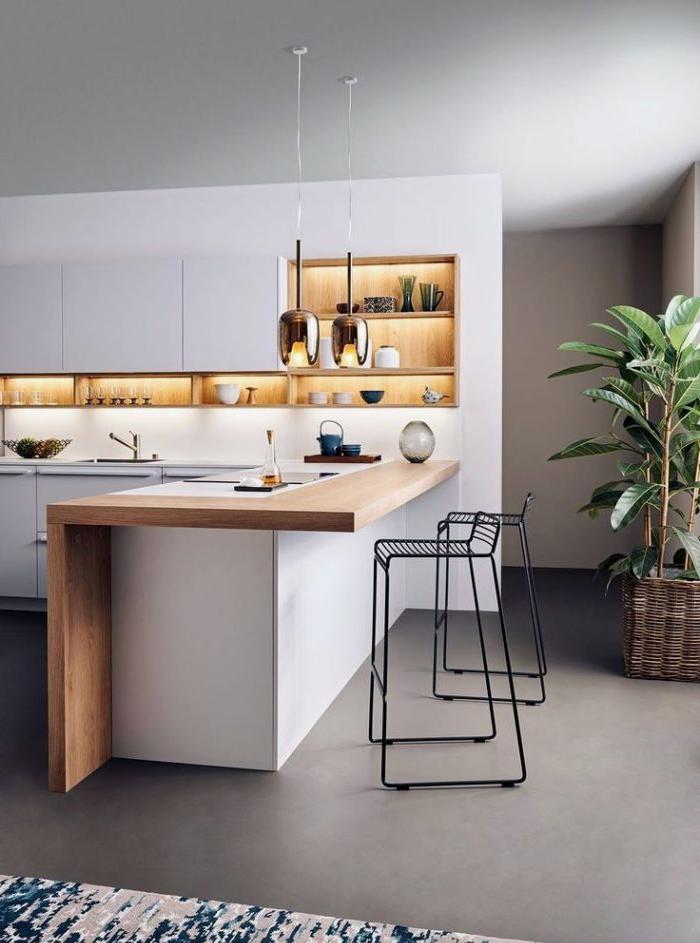 Cucina bianca combinata con un soggiorno con un pavimento sfuso in stile minimalista